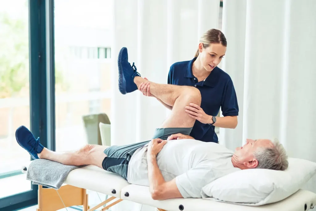 Revitalising Recovery: Effective Rehabilitation Strategies for Muscle Injuries 3 Physiotherapist assisting a patient with muscle recovery exercises Smethwick
