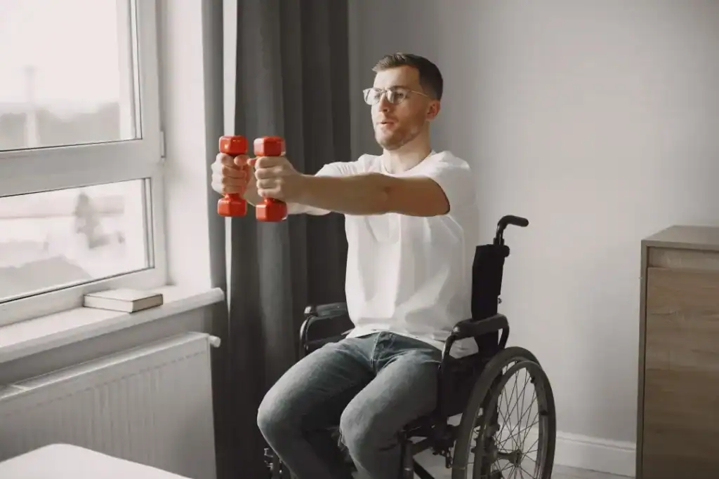Image of man doing exercise in his wheelchair to aid weight loss Smethwick