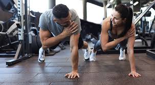 Image of man and woman doing Cardio Smethwick to tone their arms. 